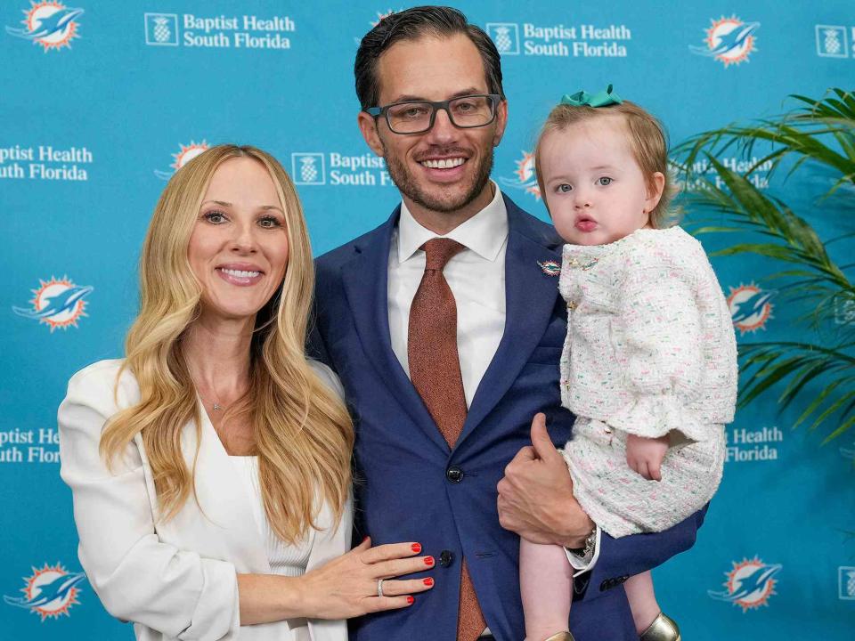 <p>Eric Espada/Getty</p> Mike McDaniel with his wife Katie and daughter Alya June