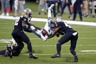 Carolina Panthers wide receiver Robby Anderson is upended by New Orleans Saints safety Chauncey Gardner-Johnson, left, and free safety Marcus Williams in the first half of an NFL football game in New Orleans, Sunday, Oct. 25, 2020. (AP Photo/Butch Dill)