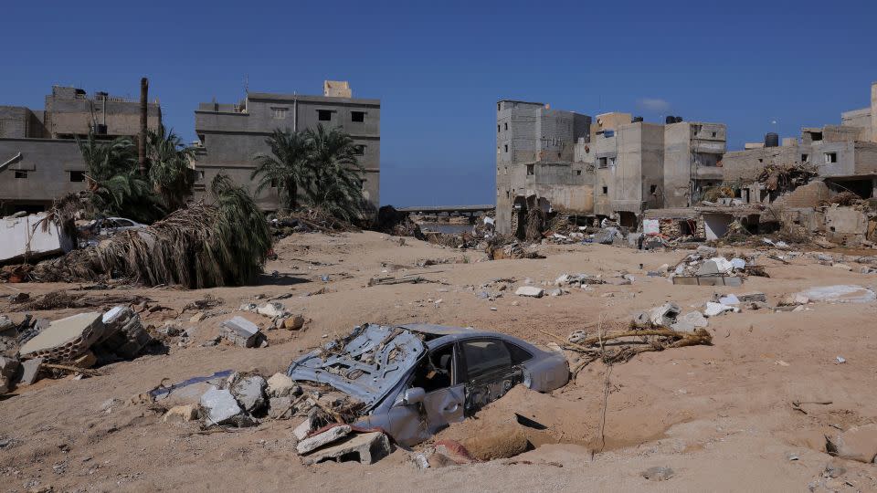 A car is half burried following floods in Derna, Libya, on September 16. - Amr Alfiky/Reuters