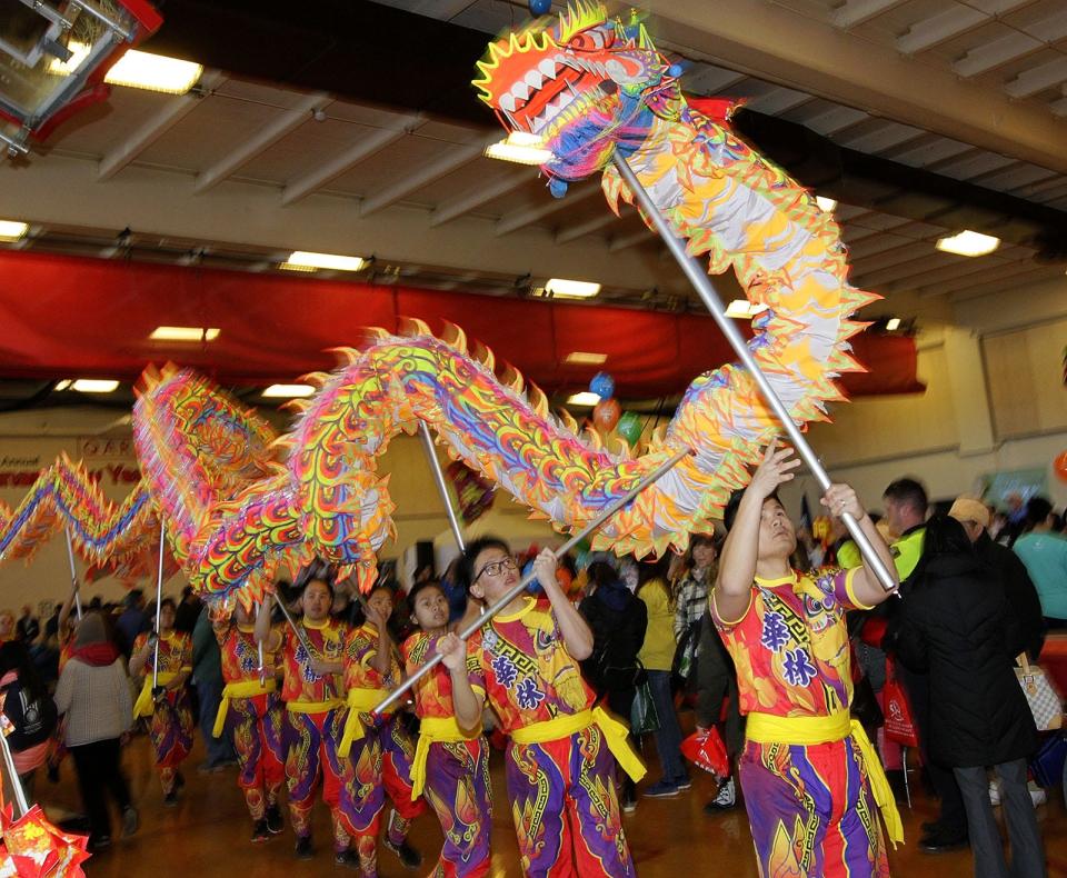 Dragon dancers weave their way through the crowd at North Quincy High School on Sunday, Feb. 10, 2019, during the 31st annual Lunar New Year Festival organized by Quincy Asian Resources Inc. (Greg Derr/ The Patriot Ledger)