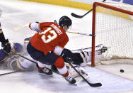 Florida Panthers center Sam Reinhart (13) scores a goal past St. Louis Blues goaltender Ville Husso (35) during the second period of an NHL hockey game Saturday, Dec. 4, 2021, in Sunrise, Fla. (AP Photo/Jim Rassol)