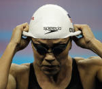 SHANGHAI, CHINA - JULY 28: Natalie Coughlin of the United States takes off her cap after she swam in heat nine of the Women's 100m Freestyle heats during Day Thirteen of the 14th FINA World Championships at the Oriental Sports Center on July 28, 2011 in Shanghai, China. (Photo by Lintao Zhang/Getty Images)