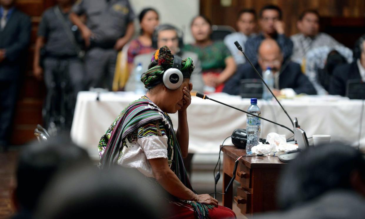 A witness cries while giving testimony in a trial against former Guatemalan dictator Gen. José Efraín Ríos Montt in 2013. <a href="https://www.gettyimages.com/detail/news-photo/ana-de-leon-cries-while-giving-testimony-as-witness-in-the-news-photo/165201899" rel="nofollow noopener" target="_blank" data-ylk="slk:Johan Ordonez/AFP via Getty Images);elm:context_link;itc:0;sec:content-canvas" class="link ">Johan Ordonez/AFP via Getty Images)</a>