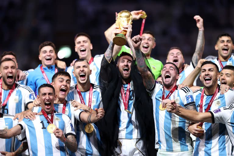 LUSAIL CITY, QATAR - DECEMBER 18: Lionel Messi of Argentina lifts the FIFA World Cup Qatar 2022 Winner's Trophy  during the FIFA World Cup Qatar 2022 Final match between Argentina and France at Lusail Stadium on December 18, 2022 in Lusail City, Qatar. (Photo by Julian Finney/Getty Images)