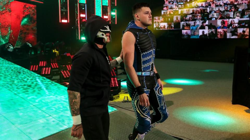 Rey and Dominik Mysterio walk to the ring before Dominik's match against Seth Rollins at SummerSlam. (Photo credit: WWE)