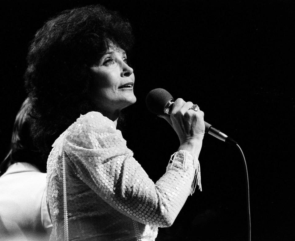 Loretta Lynn performs as a guest on the Grand Ole Opry stage Oct. 19, 1985, where host Roy Acuff returned after an absence of four months. A heart aliment had prevented the 82-year-old Acuff from performing.