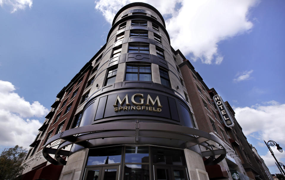 FILE -- In this Aug. 15, 2018 file photo the MGM Springfield casino's logo decorates the front facade on Main Street in Springfield, Mass. Massachusetts' first Las Vegas-style casino is throwing itself a birthday bash, Saturday, Aug. 24, 2019, with Aerosmith, New England Patriots cheerleaders and a five-tier cake. But one year after opening, MGM Springfield has underperformed and shed hundreds of jobs. Some business owners also say the promised downtown revival hasn't materialized. (AP Photo/Charles Krupa, File)