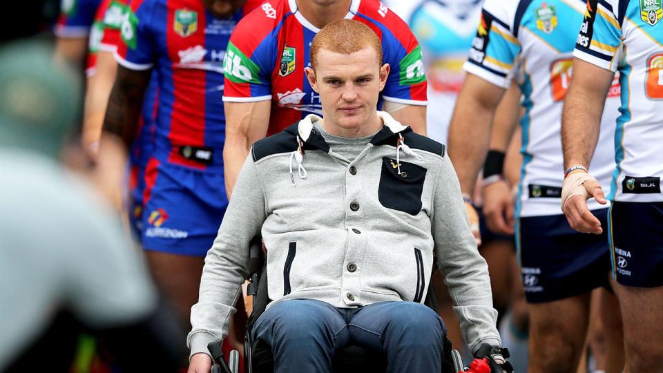 Alex McKinnon is seen here in a wheelchair before a Newcastle Knights match.