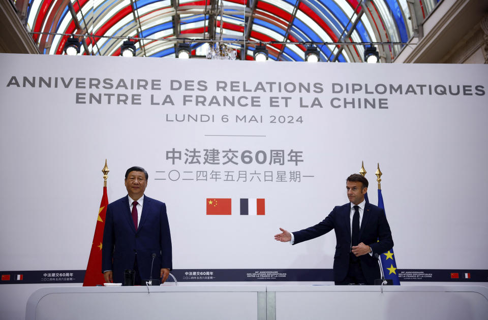 China's President Xi Jinping, left, attends a joint statement with French President Emmanuel Macron at the Elysee Palace in Paris as part of the Chinese president's two-day state visit in France, Monday, May 6, 2024. French President Emmanuel Macron put trade disputes and Ukraine-related diplomatic efforts on top of the agenda for talks Monday with Chinese President Xi Jinping, who arrived in France for a two-day state visit opening his European tour. (Sarah Meyssonnier/Pool via AP)