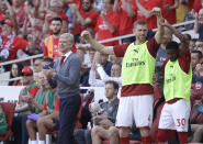 <p>Arsenal’s French manager Arsene Wenger, left, celebrates his team’s first goal during the English Premier League soccer match between Arsenal and Burnley at the Emirates Stadium in London, Sunday, May 6, 2018. The match is Arsenal manager Arsene Wenger’s last home game in charge after announcing in April he will stand down as Arsenal coach at the end of the season after nearly 22 years at the helm. (AP Photo/Matt Dunham) </p>