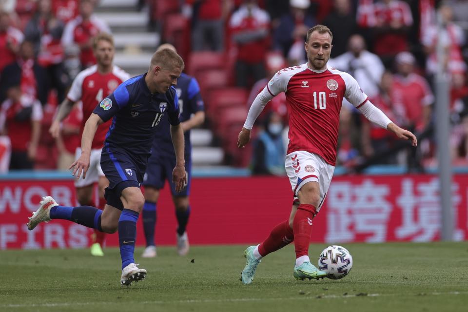 Denmark's Christian Eriksen controls the ball during the Euro 2020 soccer championship group B match between Denmark and Finland at Parken stadium in Copenhagen, Denmark, Saturday, June 12, 2021. Eriksen collapsed on the pitch and received medical assistance before being taken to hospital. (Wolfgang Rattay/Pool via AP)