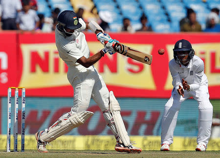 First Test cricket match - Saurashtra Cricket Association Stadium, Rajkot, India - 11/11/2016. India's Cheteshwar Pujara plays a shot. REUTERS/Amit Dave