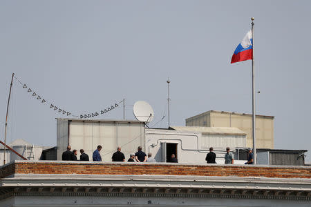 People are seen on the rooftop at the Consulate General of Russia in San Francisco, California, U.S., September 2, 2017. REUTERS/Stephen Lam