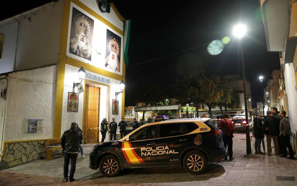 Police stand next to San Isidro church in Algeciras.