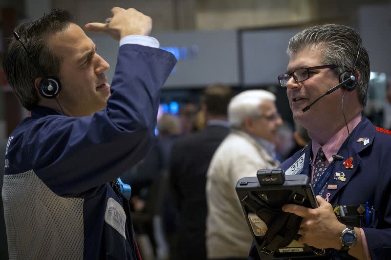 Traders work on the floor of the New York Stock Exchange