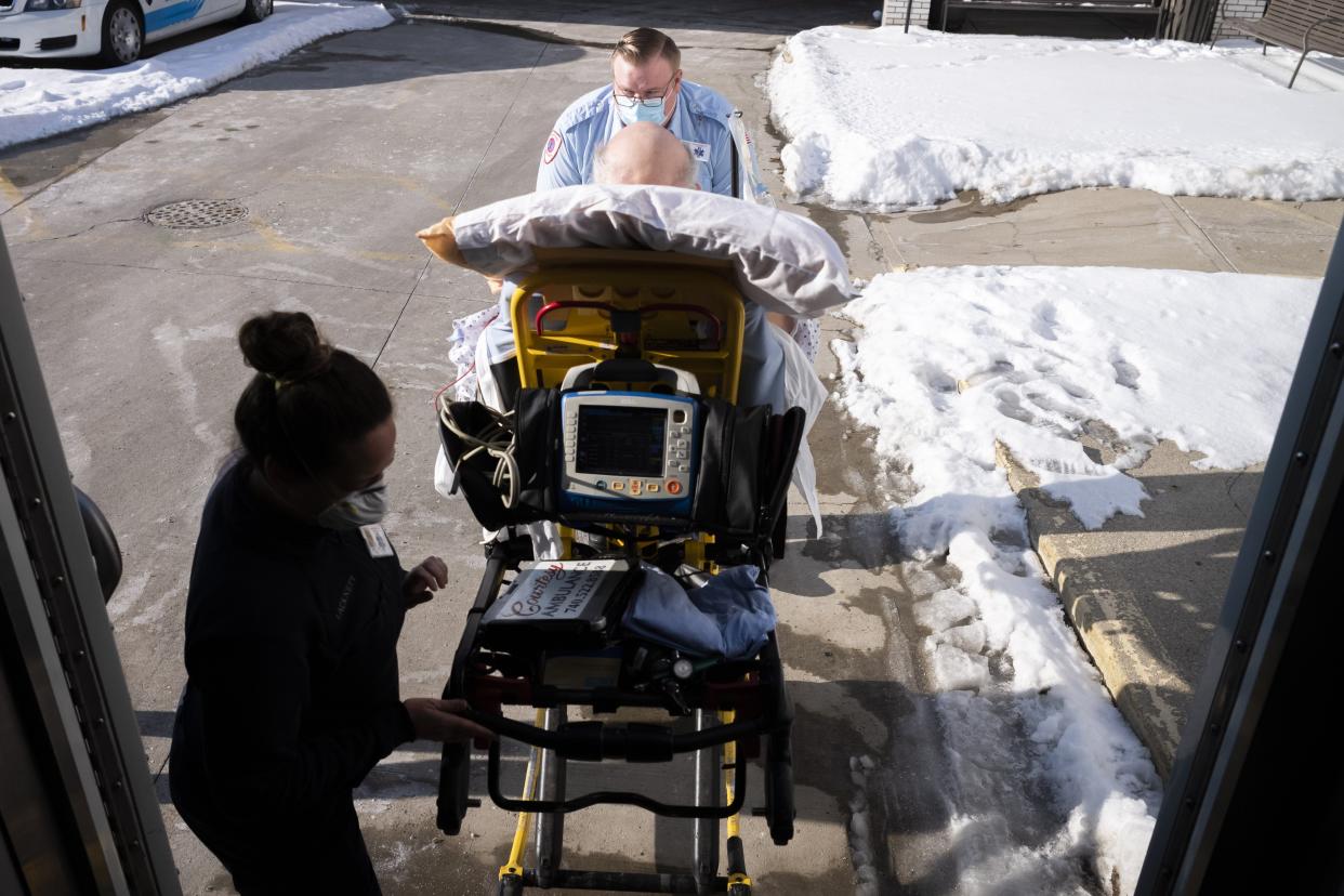 Tue., Feb. 8, 2022; Newark, Ohio, USA; Courtesy Ambulance paramedic Jacob Carver, top, and EMT Ashley Lackney, left, transported a patient to a doctor's appointment in Columbus.