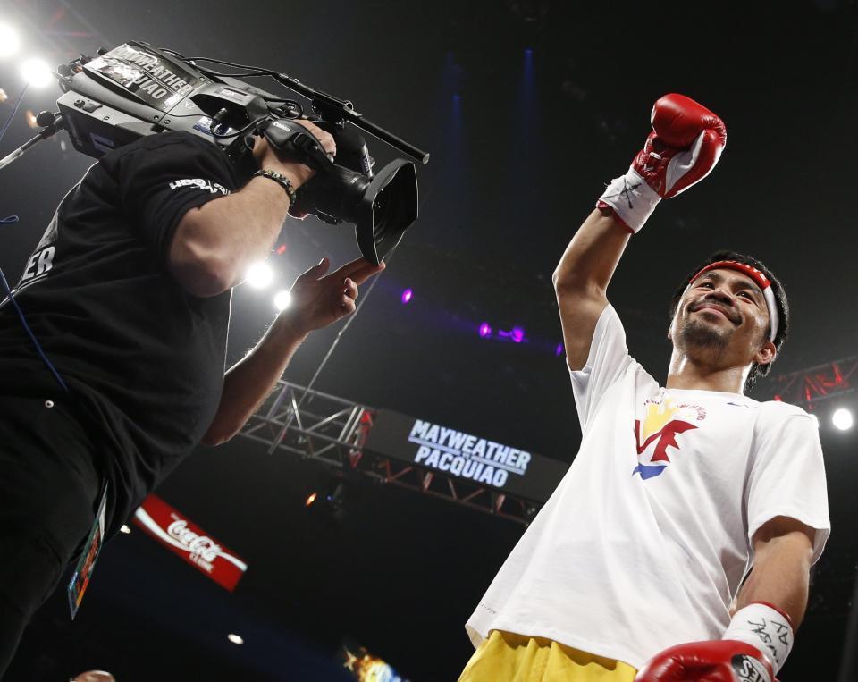 Manny Pacquiao, from the Philippines, acknowledges the crowd before the start of his world welterweight championship bout against Floyd Mayweather Jr., on Saturday, May 2, 2015 in Las Vegas. (AP Photo/John Locher)