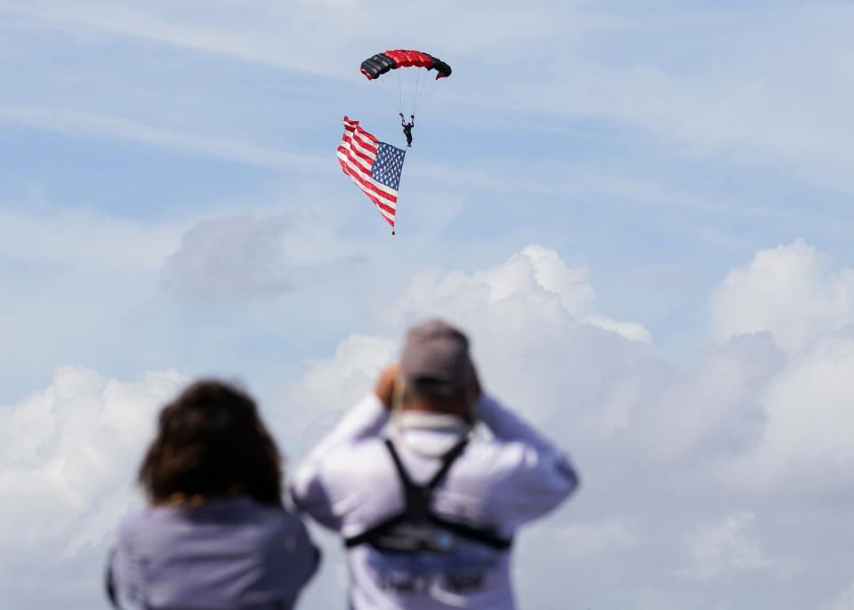 The Stuart Air Show is this weekend at Witham Field. In this Nov. 6, 2020, photo, Denita (left) and Charles Kitto, of Key Largo, watch the U.S. Army Special Operations Command Black Daggers, a parachute demonstration team, practice ahead of the event.