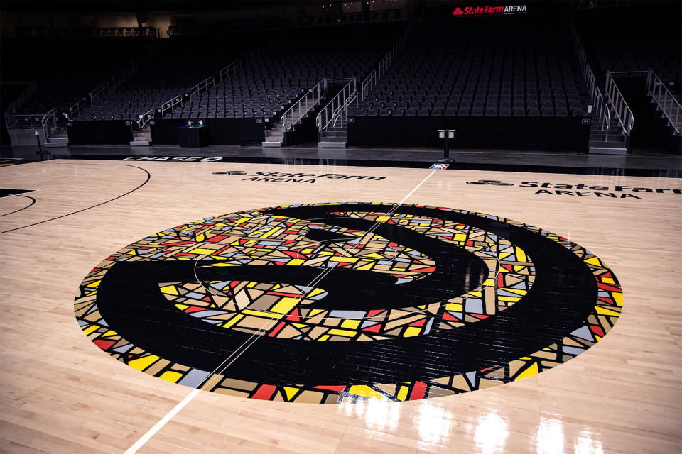 The Atlanta Hawks' MLK-inspired court design features a special stained-glass version of the Hawks’ logo, reminiscent of Ebenezer Baptist Church, at center court. (Courtesy Atlanta Hawks)