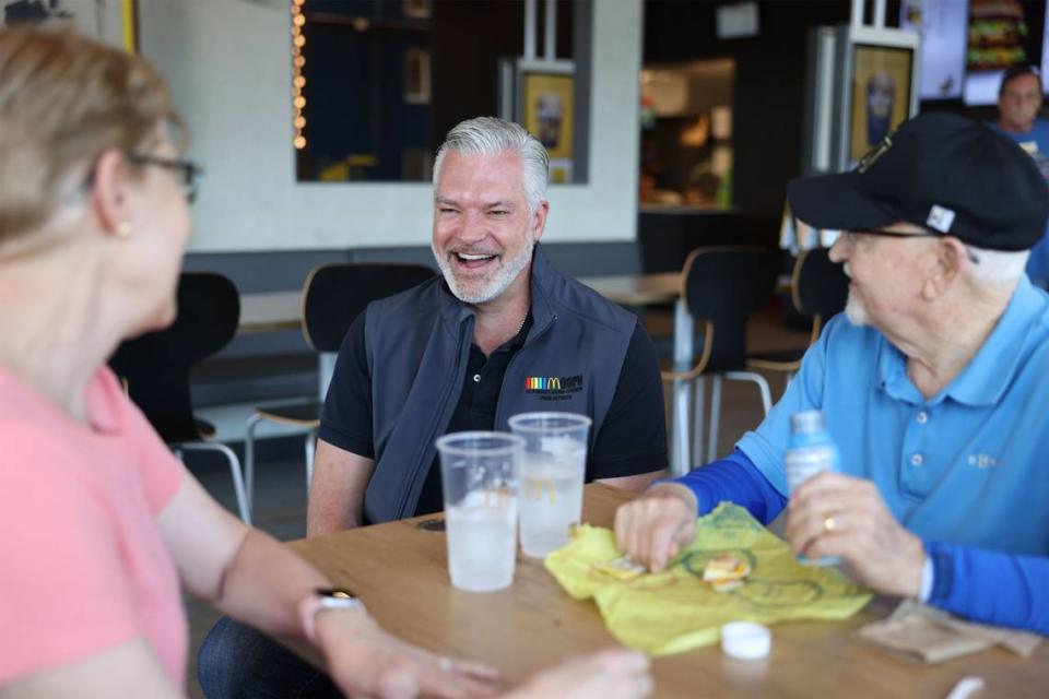 Jason Saylor shares a laugh with customers at his McDonald’s location in Indian Land, S.C., on Tuesday. Saylor owns eight McDonald’s locations in North and South Carolina. McDonald’s will have a booth at the Charlotte Pride festival. Saylor said McDonald’s has been there for him throughout his coming out story and he wants to give back.