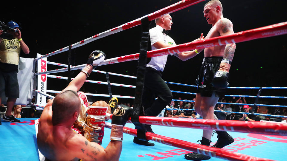 Anthony Mundine was knocked out of the ring by John Wayne-Parr in what could be his final bout. (Photo by Chris Hyde/Getty Images)