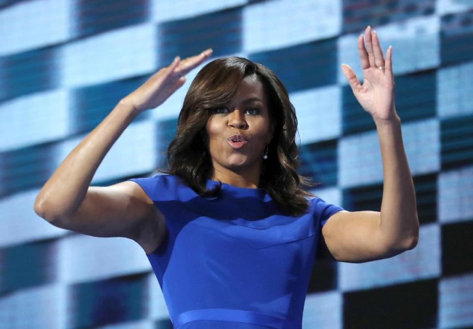 FILE - In this July 25, 2016, file photo, first lady Michelle Obama blows kisses after speaking to delegates during the first day of the Democratic National Convention in Philadelphia. When Michelle Obama considered the daunting prospect of becoming first lady, she purposely avoided turning to books by her predecessors for guidance. Instead, she turned inward (AP Photo/Carolyn Kaster, File)