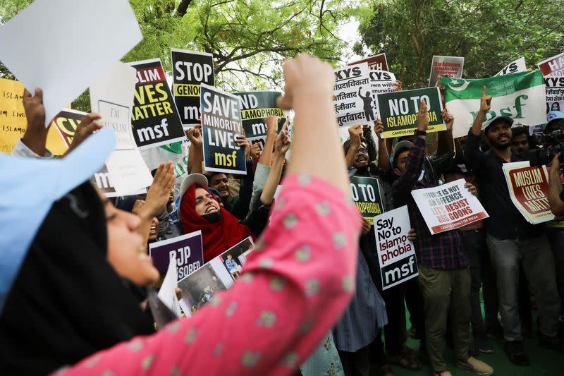 Citizens attend a peace vigil organised by citizens against what they say is rise in hate crimes and violence against Muslims, in New Delhi