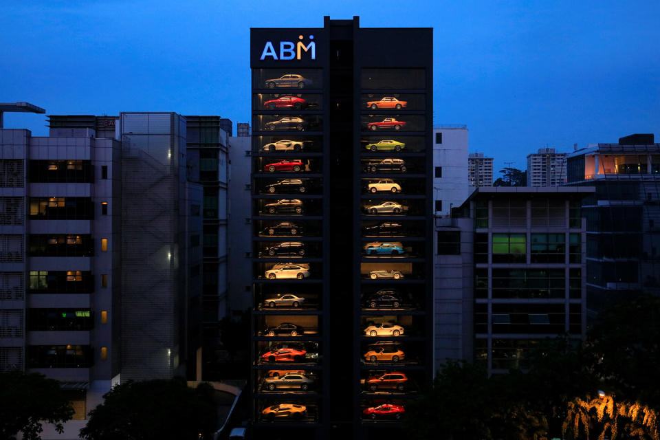 <p>An exotic used car dealership designed to resemble a vending machine in Singapore May 15, 2017. The dealership houses up to 60 exotic cars in a 15 storey building which uses a fish-bone type lift system to deliver cars to clients within minutes. (Photo: Thomas White/Reuters) </p>