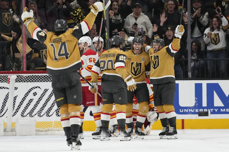 Vegas Golden Knights center William Karlsson (71) celebrates after scoring against the Calgary Flames during the third period of an NHL hockey game Tuesday, Dec. 12, 2023, in Las Vegas. (AP Photo/John Locher)