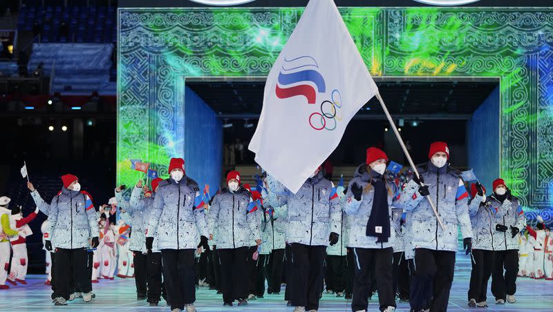 Athletes competing under the banner of the Russian Olympic Committee carry a flag into the stadium during the opening ceremony of the 2022 Winter Olympics, on Feb. 4, 2022, in Beijing. The IOC suspended the Russian Olympic Committee on Thursday.