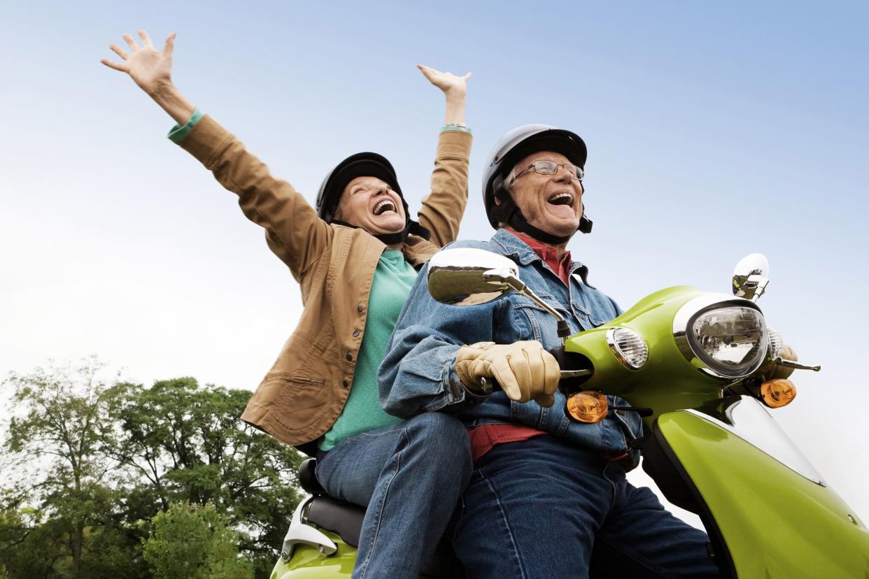 senior couple on scooter