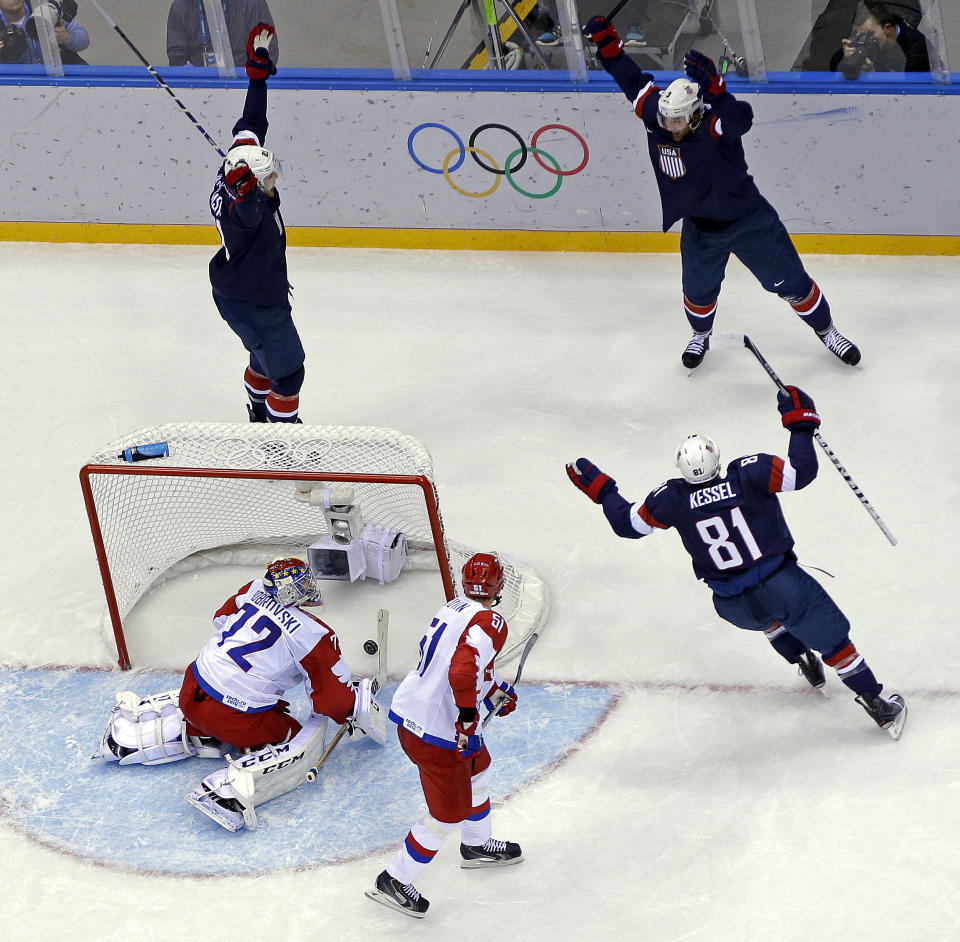 USA defenseman Cam Fowler celebrates after scoring a goal on Russia goaltender Sergei Bobrovski during the second period of a men's ice hockey game at the 2014 Winter Olympics, Saturday, Feb. 15, 2014, in Sochi, Russia. (AP Photo/Mark Humphrey )