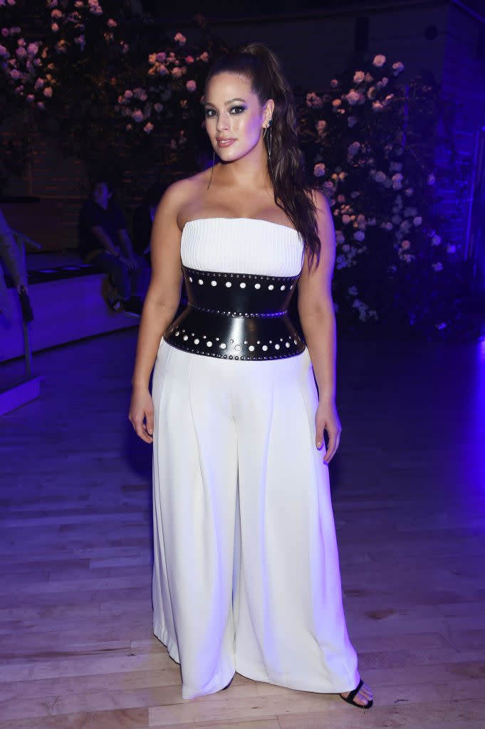 <p>Graham wore a white strapless jumpsuit with a wide black belt for a rare appearance off the runway. (Photo: Getty Images) </p>