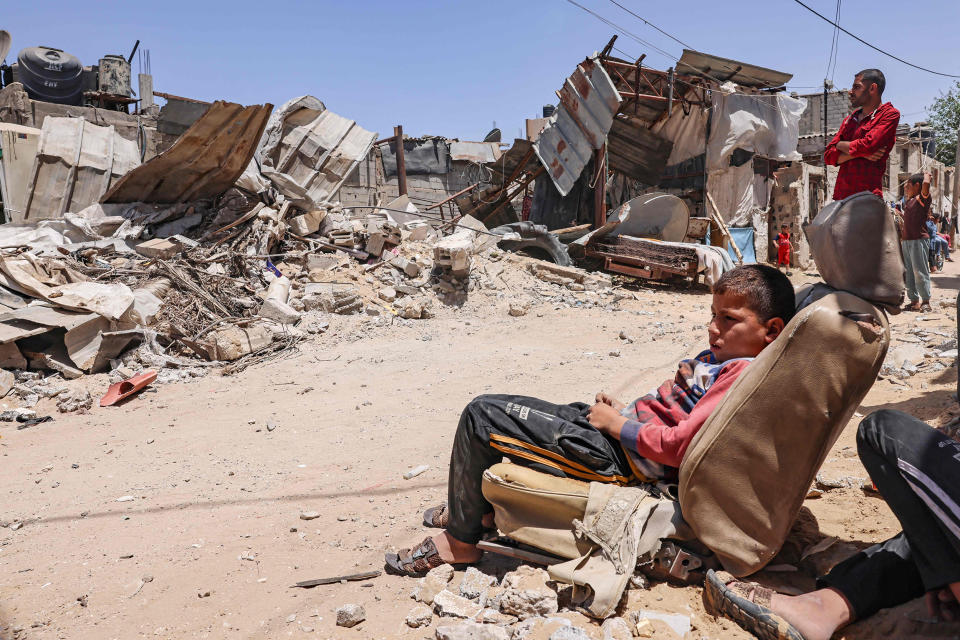 Image: Gaza residents inspect their house after it was destroyed by an Israeli airstrike in the southern Gaza Strip on Sunday. (Said Khatib / AFP - Getty Images)