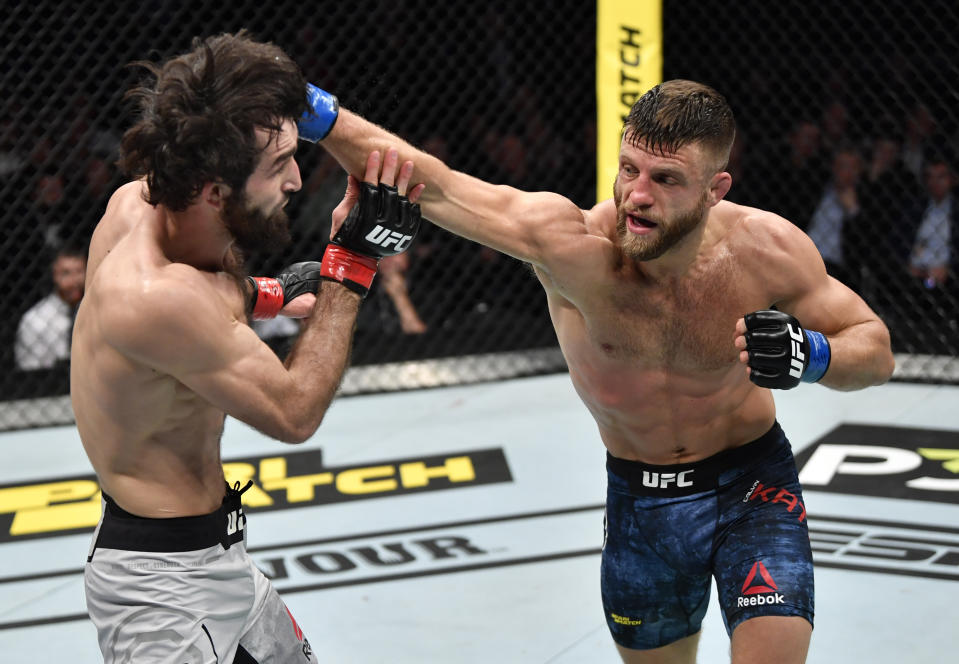 MOSCOW, RUSSIA - NOVEMBER 09:  (R-L) Calvin Kattar punches Zabit Magomedsharipov of Russia in their featherweight fight during the UFC Fight Night event at CSKA Arena on November 09, 2019 in Moscow, Russia. (Photo by Jeff Bottari/Zuffa LLC via Getty Images)