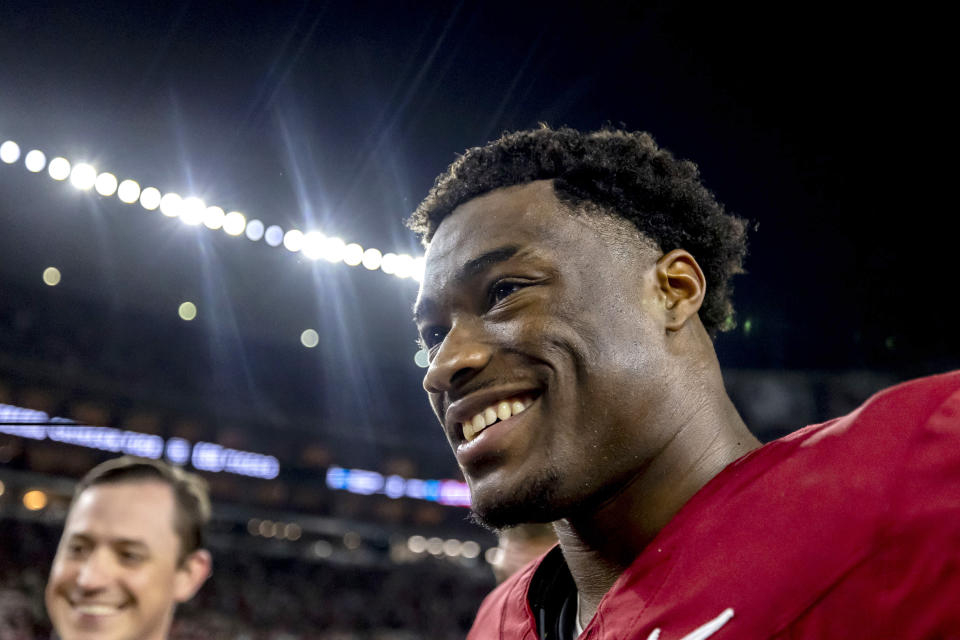 Alabama quarterback Jalen Milroe smiles as he departs the field with a win over LSU after an NCAA college football game, Saturday, Nov. 4, 2023, in Tuscaloosa, Ala. (AP Photo/Vasha Hunt)