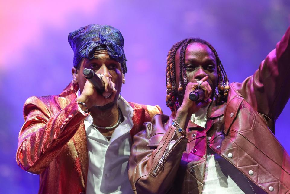 Jon Batiste, left, performs with guest Fireboy DML at the Outdoor Theatre during the second weekend of the Coachella Valley Music and Arts Festival in Indio, Calif., April 20, 2024.