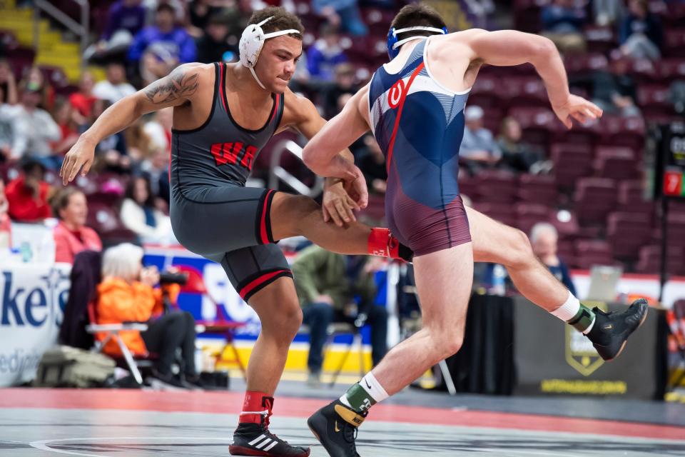 West Allegheny's Shawn Taylor (left) wrestles Chartiers Valley's Dylan Evans in the 160-pound championship bout at the PIAA Class 3A Wrestling Championships at the Giant Center on March 11, 2023, in Hershey. Evans won by decision, 3-2 UTB. 