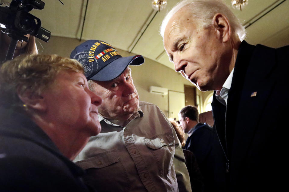 Democratic presidential candidate former Vice President Joe Biden speaks to Barbara and James Graham of Rochester, N.H. at a campaign event, Wednesday, Feb. 5, 2020, in Somersworth, N.H. (Elise Amendola/AP)      