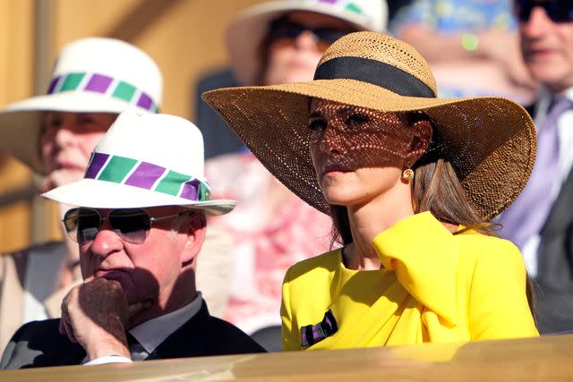 <p>Zac Goodwin/PA Images via Getty</p> Kate Middleton wears a hat at Wimbledon in 2022