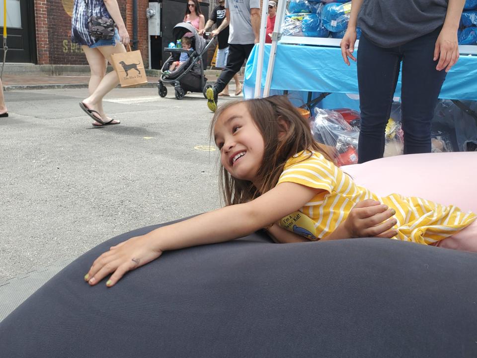 Six-year-old Tenley Chen of Manchester definitely approves of Yogibo, the ultimate in bean bag furniture technology.