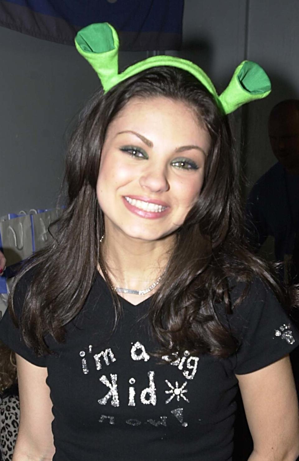 Close-up of Mila smiling and wearing a "I'm a big kid" T-shirt
