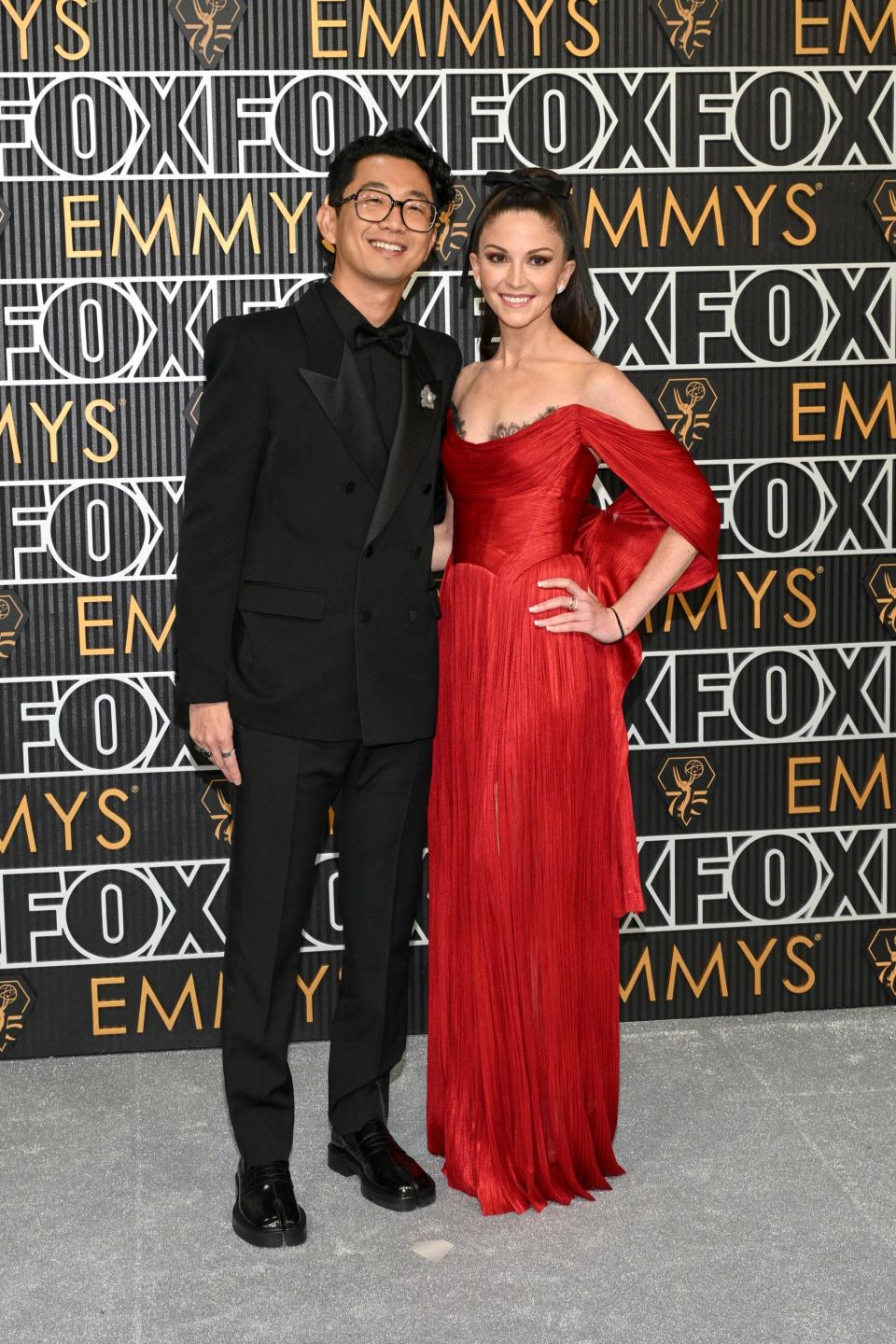 Lee Sung Jin and Caitlin Lee attend the 2024 Emmy Awards.