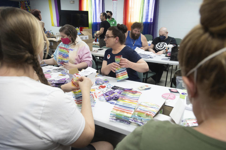 People help assemble reproductive health kits at The Community Center in Boise, Idaho, on Friday, April 12, 2024. About two dozen people filled boxes with emergency contraception, condoms and information about accessing abortions. (AP Photo/Kyle Green)