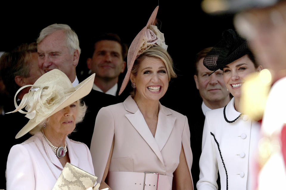 From left, Britain's Camilla, the Duchess of Cornwal, Queen Maxima of the Netherlands and Britain's Kate, the Duchess of Cambridge, watch the annual Order of the Garter Service at St George's Chapel, Windsor Castle, England, Monday, June 17, 2019. (Steve Parsons/PA via AP)