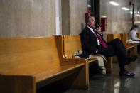 Defense attorney Michael van der Veen talks on the phone outside the courtroom during jury deliberation in the Trump Organization tax fraud case, Tuesday, Dec. 6, 2022, in New York. (AP Photo/Julia Nikhinson)