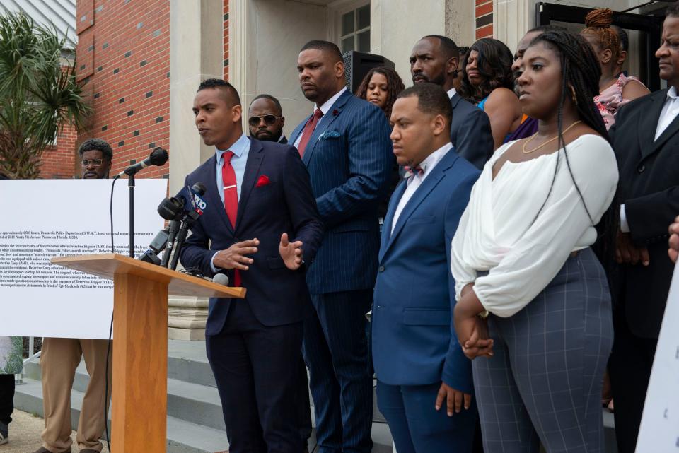 Attorney James Bryant, from The Los Angeles office of The Cochran Firm, and his clients, the family of Corey Marioneaux, Jr., address the media during a press conference on the steps of the Friendship Missionary Baptist Church on Thursday, Feb. 24, 2022. 