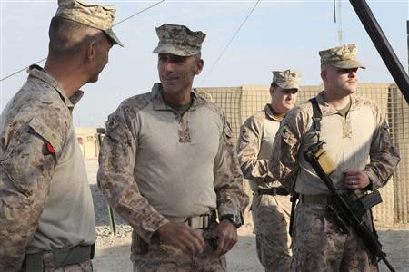 U.S. Marine Corps Major General Gregg A. Sturdevant (2nd L) speaks to Marines at Camp Hanson in Helmand province, Afghanistan in this November 22, 2012 handout photograph provided by the U.S. REUTERS/Sgt. Keonaona C. Paulo/U.S. Marine Corps/Handout via Reuters