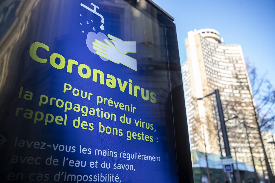 FILE - In this photo taken on March 9, 2020 a sign advises about the coronavirus outbreak in Mulhouse, eastern France. The Grand Est region is now the epicenter of the outbreak in France, which has buried the third most virus victims in Europe, after Italy and Spain. The crisis there can be traced largely to a daylong evangelical church gathering in Mulhouse of hundreds of people at the end of February. For most people, the new coronavirus causes only mild or moderate symptoms. For some it can cause more severe illness. (AP Photo/Jean-Francois Badias, File)