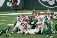 Cleveland Browns running back Kareem Hunt (27) recovers a fumble by quarterback Baker Mayfield during the second half of an NFL football game against the New York Jets, Sunday, Dec. 27, 2020, in East Rutherford, N.J. The ruling on the field resulted in a turnover on downs ending the drive. (AP Photo/Corey Sipkin)